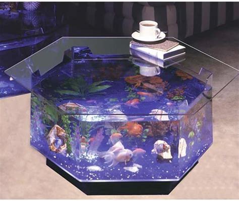 Fish aquarium coffee table - Well, these tables shout “look at me!” without saying a word. The aquariums are designed to fit into various parts of the table. Some tables house the giant aquarium in their bases, offering a beautiful, submerged world beneath. Others seamlessly integrate the aquarium into the table’s surface, giving the illusion that your plates and ...